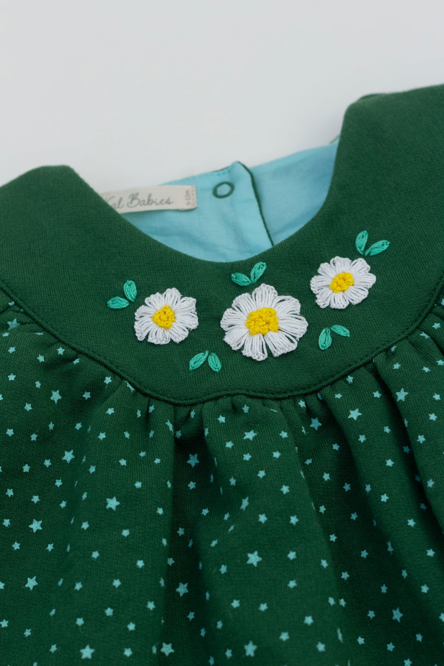 Fleece green dress with hand embroidered flowers