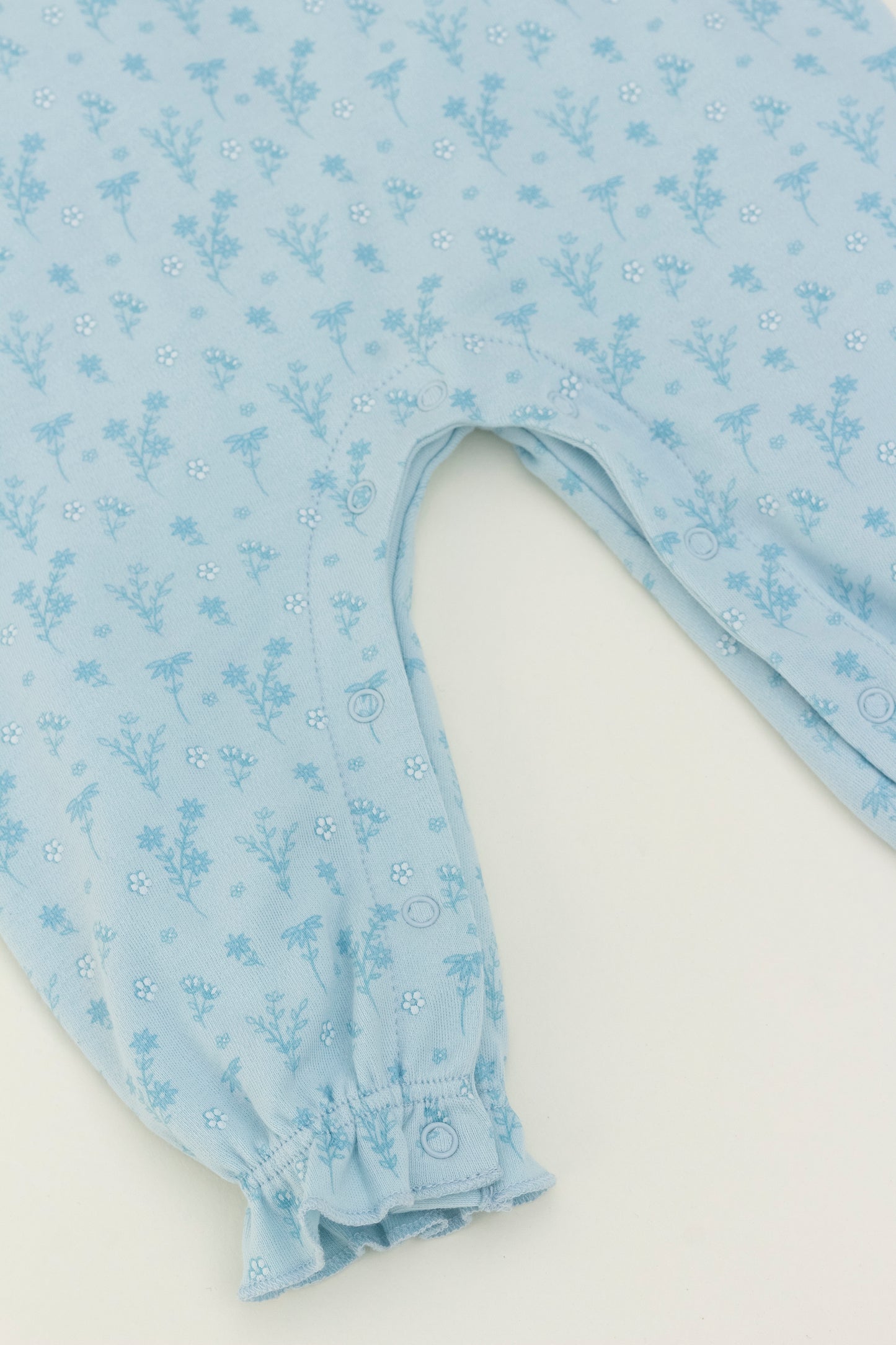 Light blue long sleeve romper with flower print