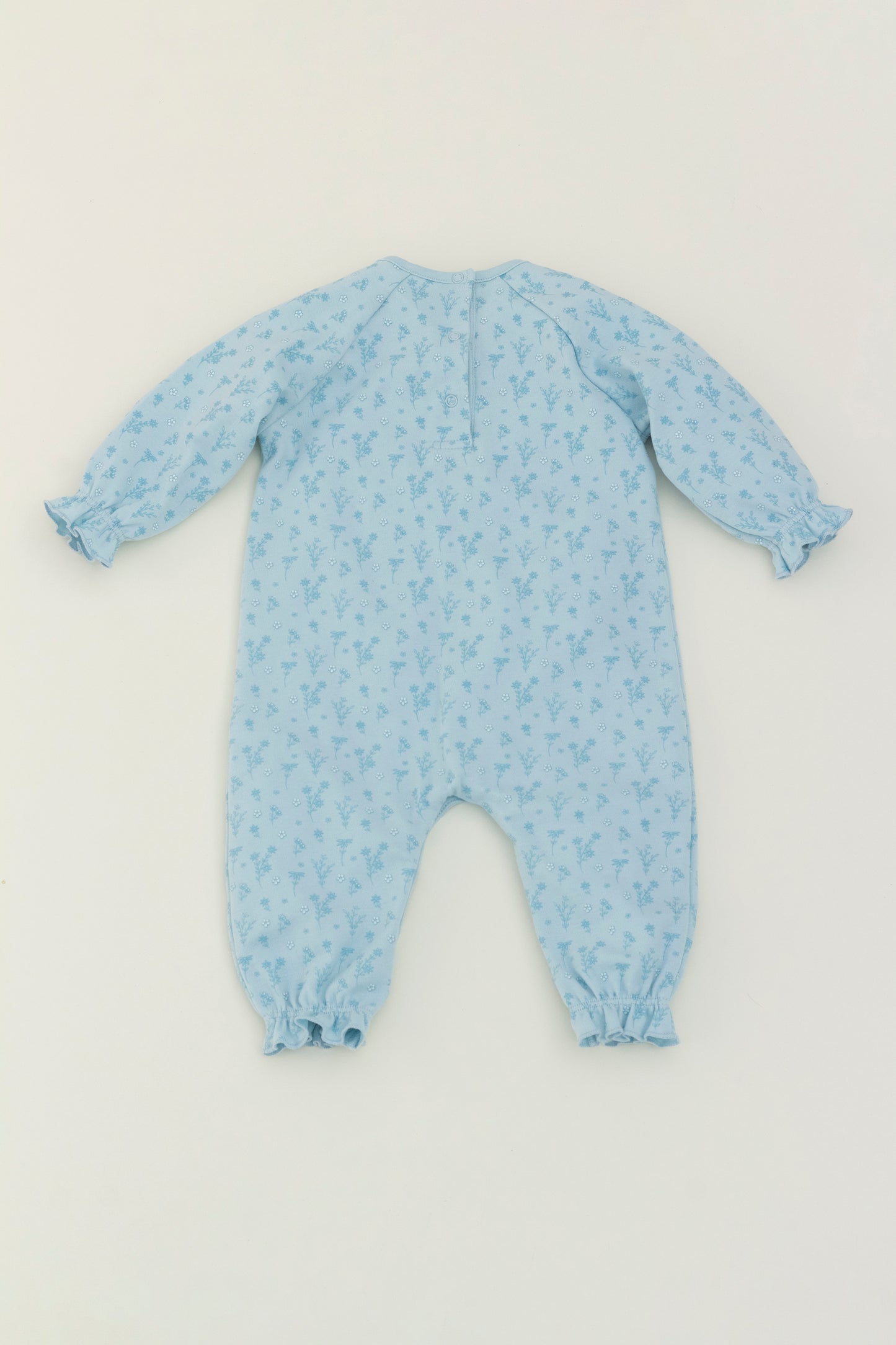 Light blue long sleeve romper with flower print