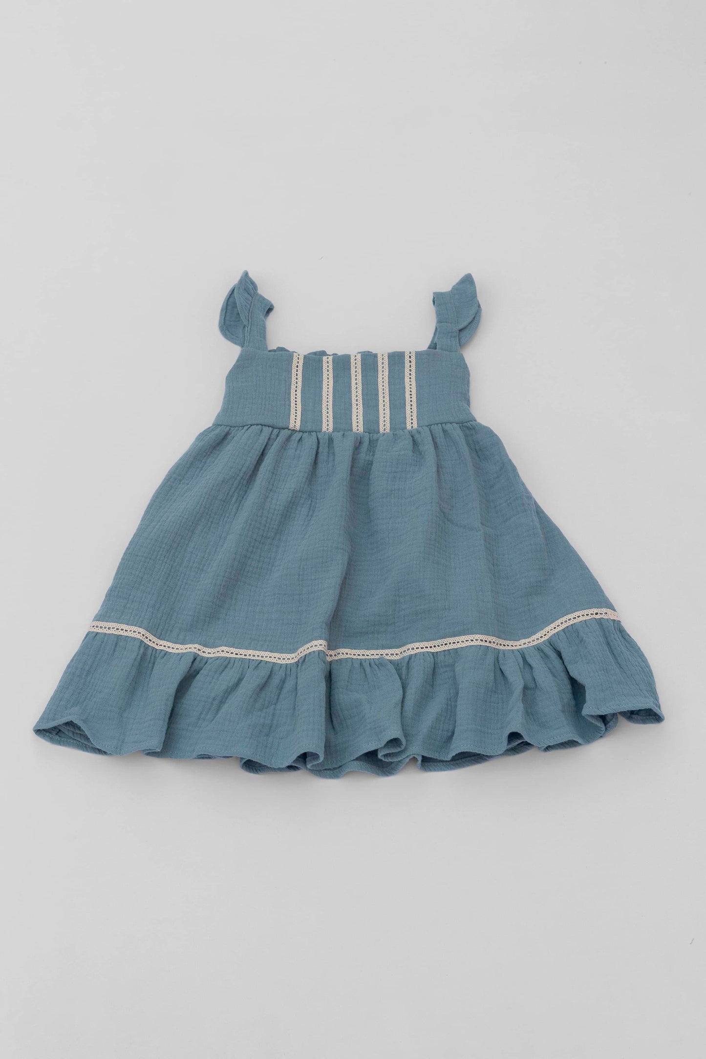 Blue organic cotton muslin dress with lace for baby girls front view