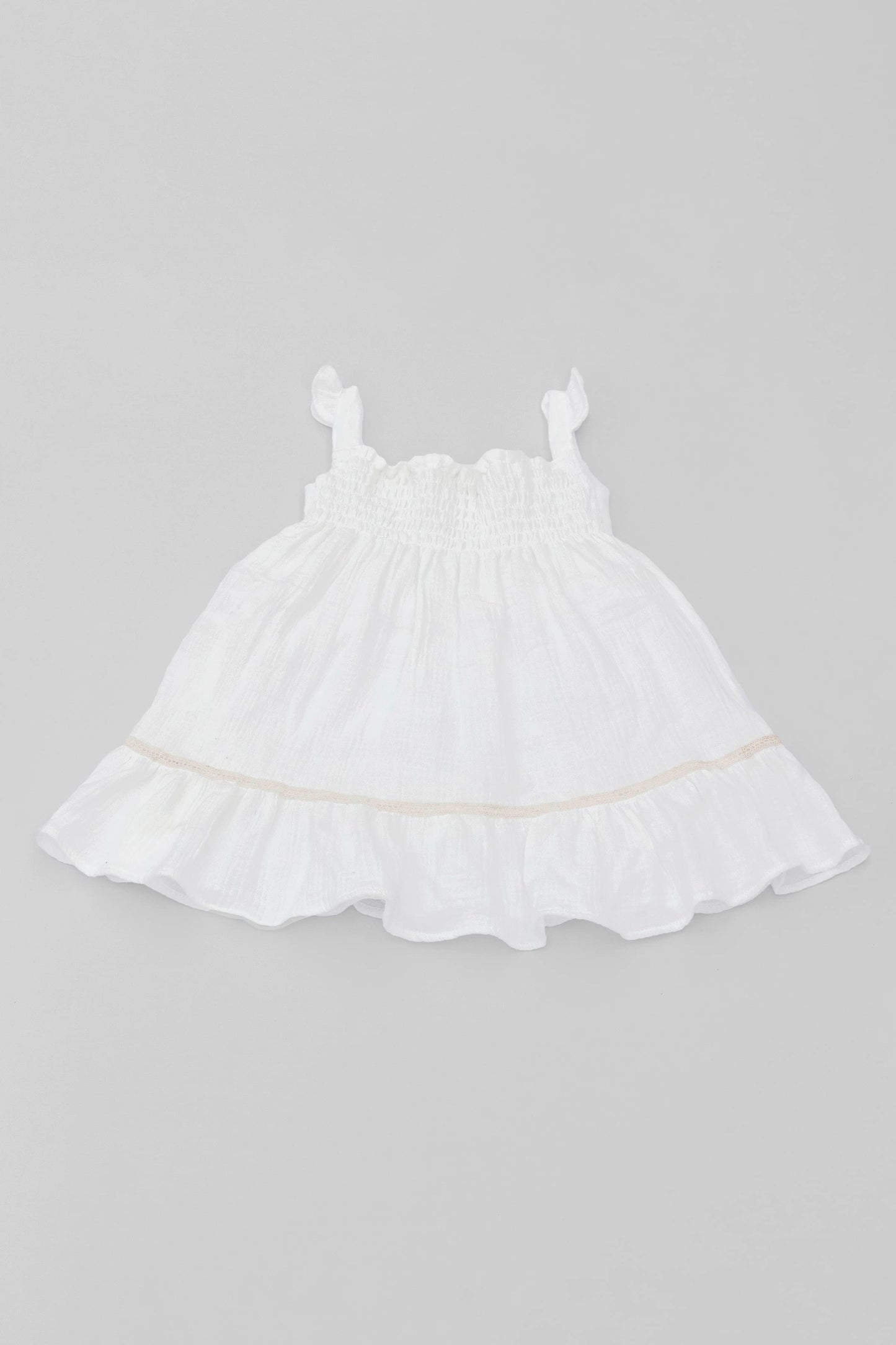 White organic cotton muslin dress with lace for baby girls backview