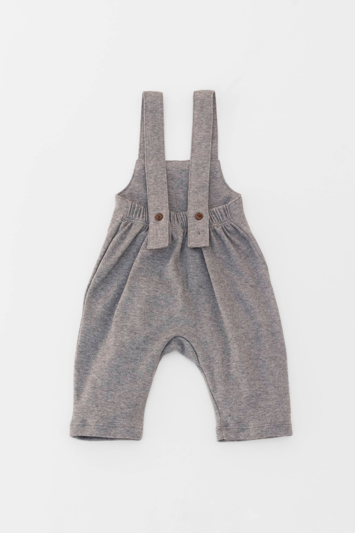 Organic-cotton overall with wooden buttons.