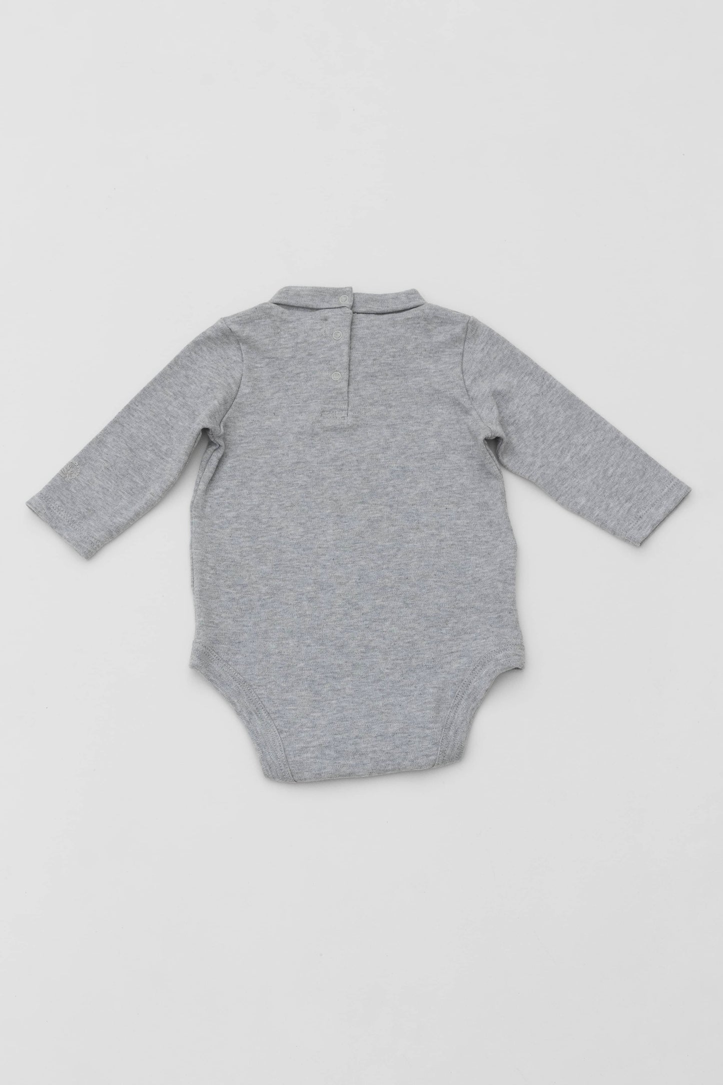 Long sleeve turtleneck bodysuit. Back opening. Snaps inseam. Embroidery detail on sleeve. Heather grey. Back view
