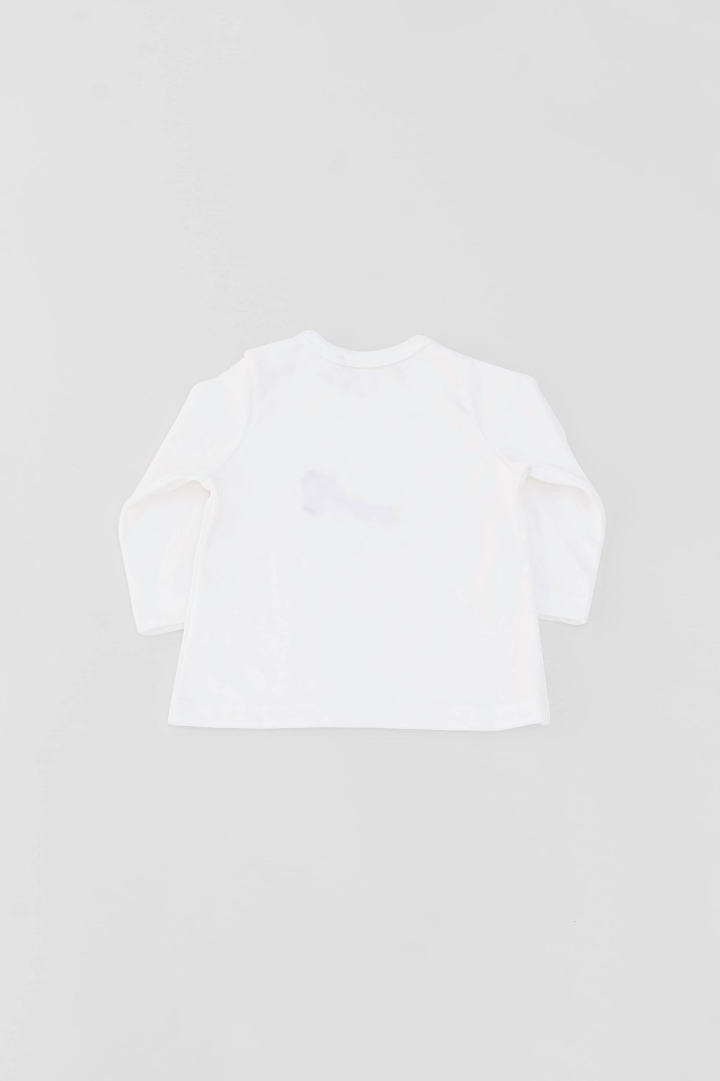 Long sleeve crewneck top with buttons at shoulder. Printed bear with scarf appliqué. Eco white organic pima cotton. Back view