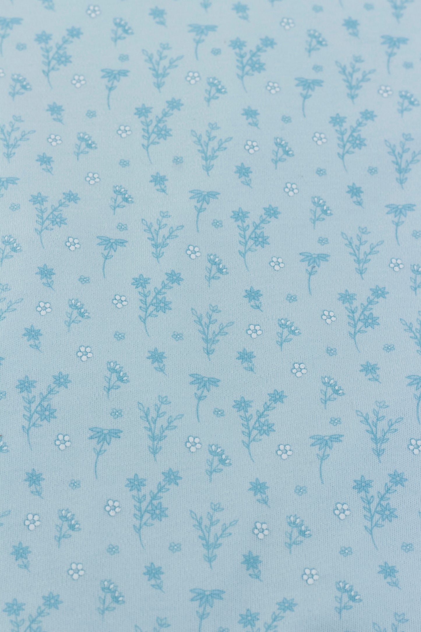 Light blue long sleeve romper with flower print