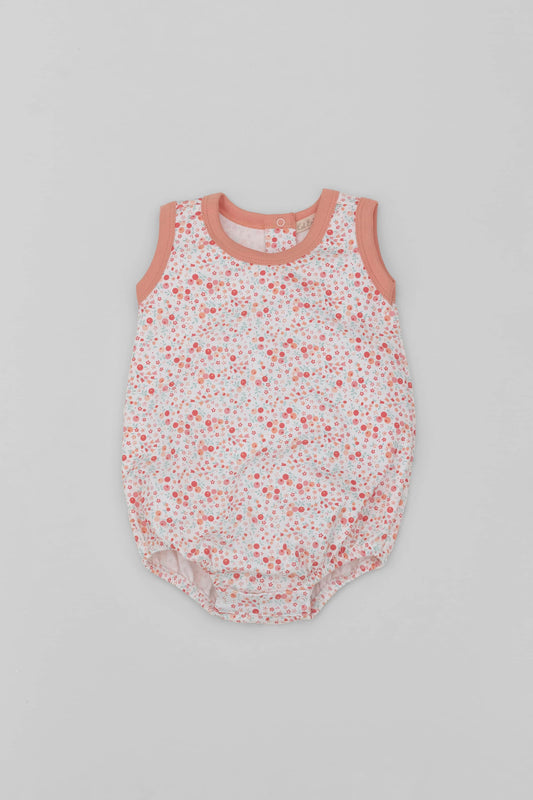 Organic pima cotton baby bubble, floral printing and contrast piping in soft melon. Front view