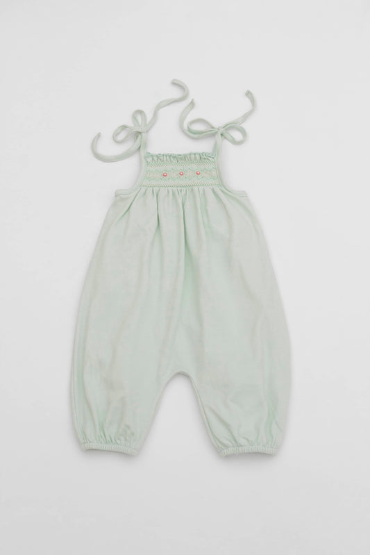 Smocked mint green organic romper with straps and embroidery - front