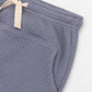 Blue moon joggers with elasticized waist, drawstring and kangaroo pocket. Front detail