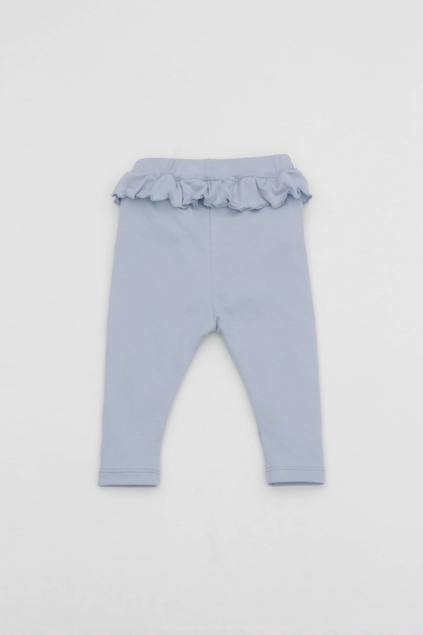 Baby blue leggings with ruffled accent on the waistband. Front