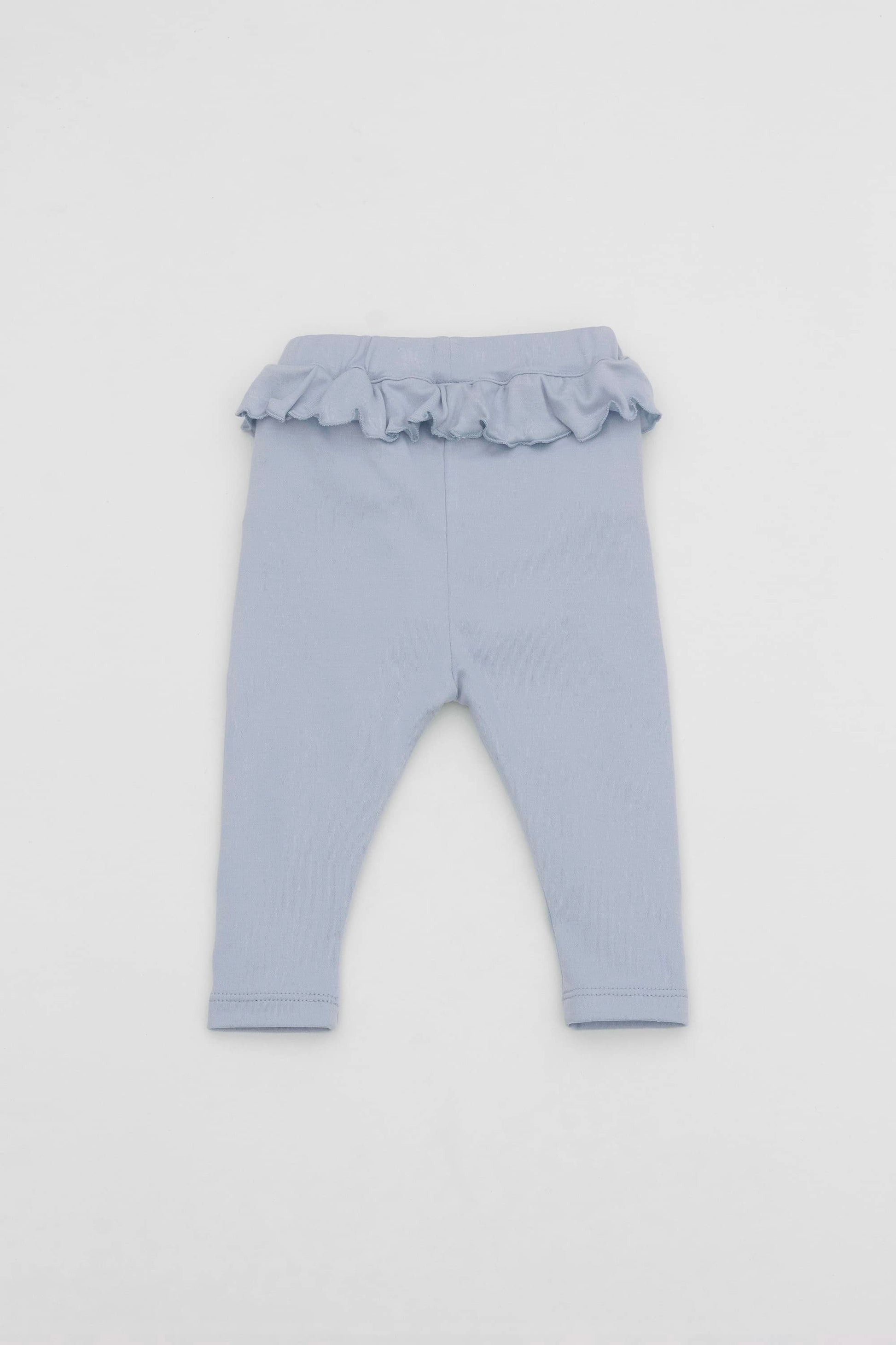 Baby blue leggings with ruffled accent on the waistband. Front