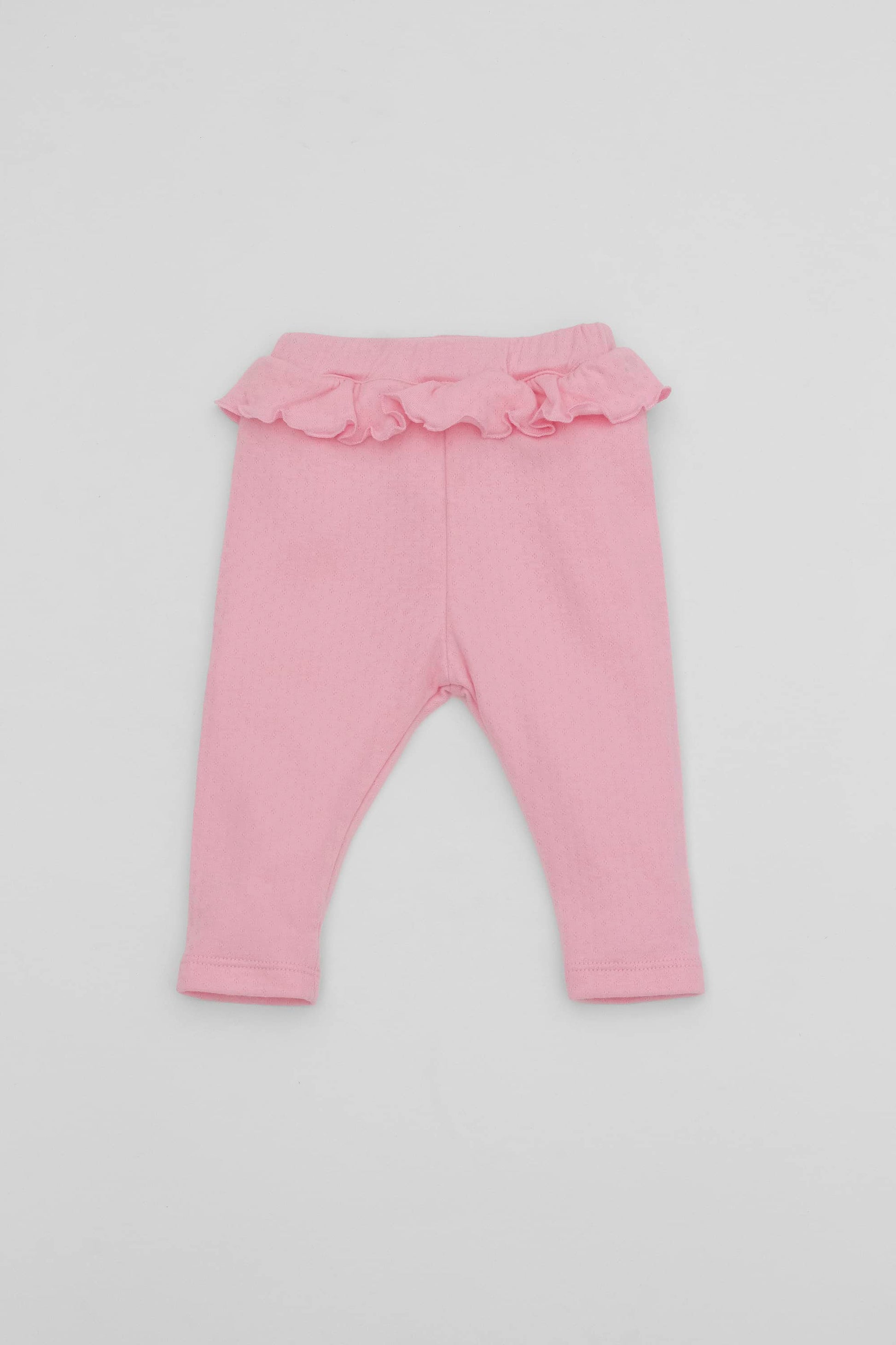 Pink leggings with ruffled accent on the waistband. Front