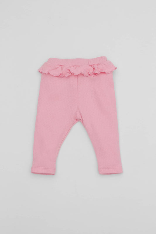 Pink leggings with ruffled accent on the waistband. Front