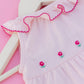 Pink romper with hand embroidered flowers