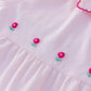 Pink romper with hand embroidered flowers