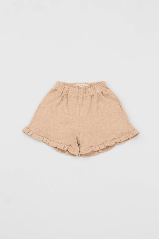 Organic pima cotton shorts with ruffle hem, elasticized waist and fake pockets. Sand. Front view