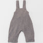 Organic-cotton overall with wooden buttons.