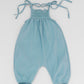 Smocked blue organic romper with straps and embroidery