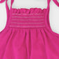 Smocked very berry organic romper with straps and embroidery. Back view detail