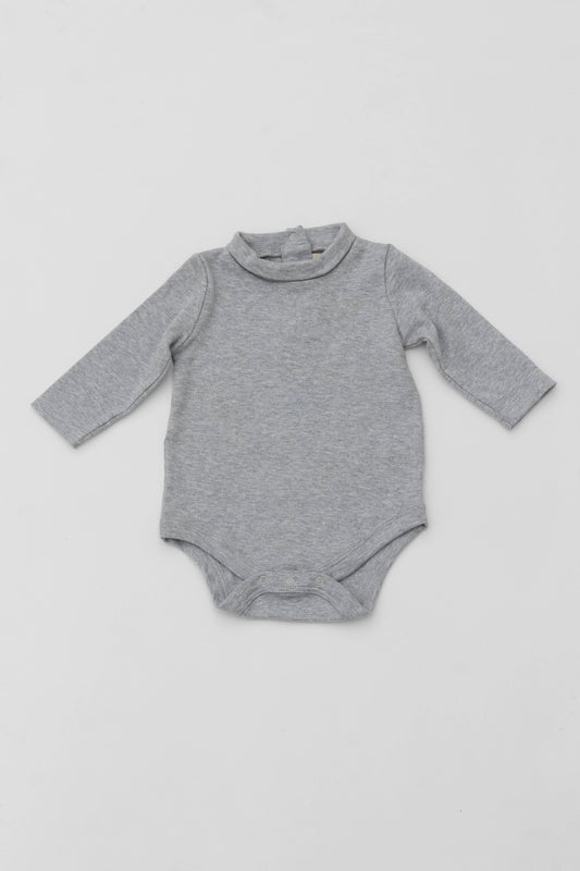 Long sleeve turtleneck bodysuit. Back opening. Snaps inseam. Embroidery detail on sleeve. Heather grey. Front view