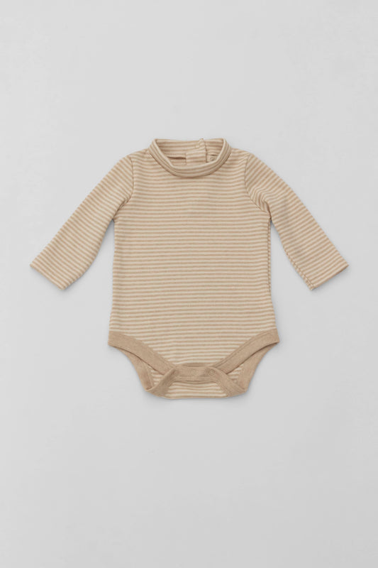 Long sleeve turtleneck bodysuit. Back opening. Contrasting piping. Snaps inseam. Embroidery detail on sleeve. Natural/sand striped fabric. Front view