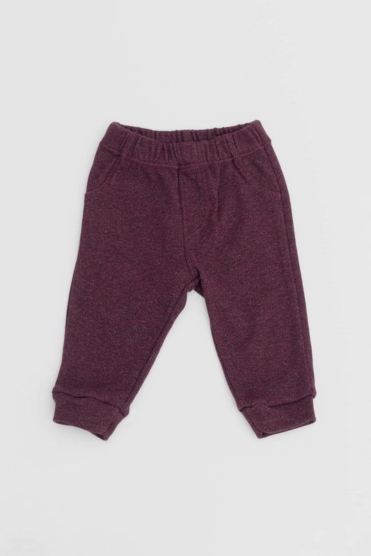 Elastic waistband pants with fake front pockets and closure. Burgundy certified organic pima cotton. Front view